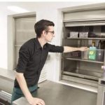 a-man-arranging-the-food-in-the-Dumbwaiter-2